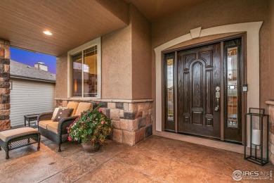 Tranquil lake views enhance the sense of calmness as you enter on Highland Meadows Golf Course in Colorado - for sale on GolfHomes.com, golf home, golf lot