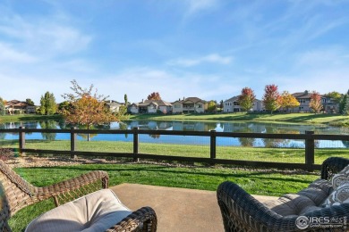 Tranquil lake views enhance the sense of calmness as you enter on Highland Meadows Golf Course in Colorado - for sale on GolfHomes.com, golf home, golf lot