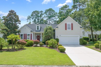 Lush landscaping surrounds this 4-bedroom (One bedroom is on The Founders Club At Pawleys Island in South Carolina - for sale on GolfHomes.com, golf home, golf lot