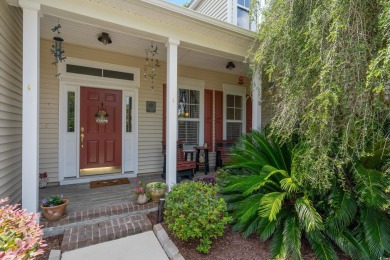 Lush landscaping surrounds this 4-bedroom (One bedroom is on The Founders Club At Pawleys Island in South Carolina - for sale on GolfHomes.com, golf home, golf lot