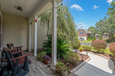 Lush landscaping surrounds this 4-bedroom (One bedroom is on The Founders Club At Pawleys Island in South Carolina - for sale on GolfHomes.com, golf home, golf lot