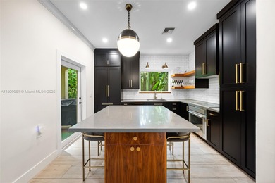 This elegant 4 Bed, 3 Bath Spanish Colonial-style residence on Riviera Country Club in Florida - for sale on GolfHomes.com, golf home, golf lot