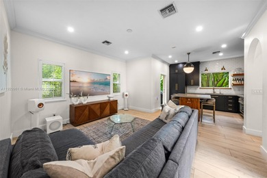 This elegant 4 Bed, 3 Bath Spanish Colonial-style residence on Riviera Country Club in Florida - for sale on GolfHomes.com, golf home, golf lot