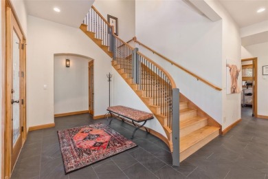This stunning home is tucked into a quiet cul-de-sac in the on Rollingstone Ranch Golf Club in Colorado - for sale on GolfHomes.com, golf home, golf lot