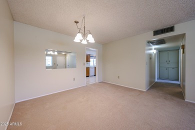 Welcome to this move-in-ready 2-bedroom, 2-bath end unit condo on Sun City Lakes West and East in Arizona - for sale on GolfHomes.com, golf home, golf lot