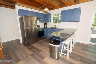 Completely updated and move-in ready! This contemporary home in on The Hideout Golf in Pennsylvania - for sale on GolfHomes.com, golf home, golf lot