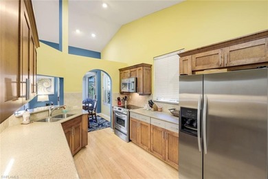 Perched along an idyllic tree-lined street within the Harbor on Bonita Bay West in Florida - for sale on GolfHomes.com, golf home, golf lot