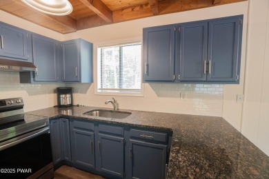 Completely updated and move-in ready! This contemporary home in on The Hideout Golf in Pennsylvania - for sale on GolfHomes.com, golf home, golf lot