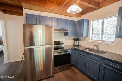 Completely updated and move-in ready! This contemporary home in on The Hideout Golf in Pennsylvania - for sale on GolfHomes.com, golf home, golf lot