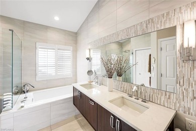 Perched along an idyllic tree-lined street within the Harbor on Bonita Bay West in Florida - for sale on GolfHomes.com, golf home, golf lot