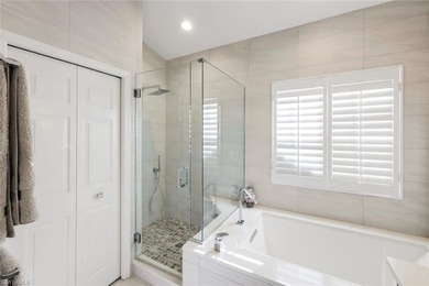 Perched along an idyllic tree-lined street within the Harbor on Bonita Bay West in Florida - for sale on GolfHomes.com, golf home, golf lot