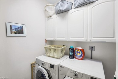 Perched along an idyllic tree-lined street within the Harbor on Bonita Bay West in Florida - for sale on GolfHomes.com, golf home, golf lot