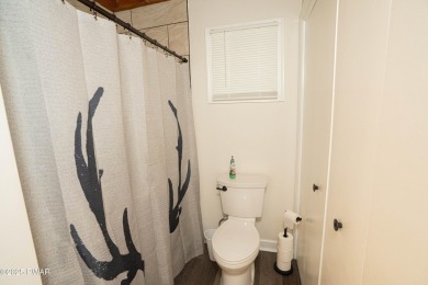 Completely updated and move-in ready! This contemporary home in on The Hideout Golf in Pennsylvania - for sale on GolfHomes.com, golf home, golf lot