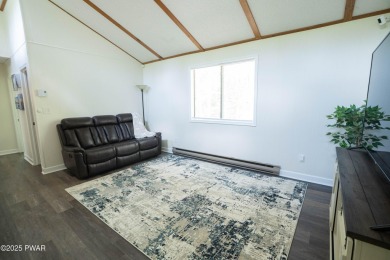 Completely updated and move-in ready! This contemporary home in on The Hideout Golf in Pennsylvania - for sale on GolfHomes.com, golf home, golf lot