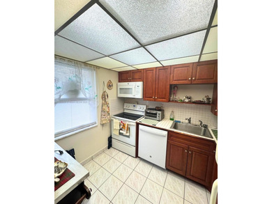 Beautifully maintained 1-bedroom, 1-bathroom condo nestled in a on Oriole Golf and Tennis Club in Florida - for sale on GolfHomes.com, golf home, golf lot