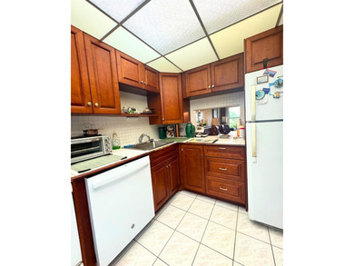 Beautifully maintained 1-bedroom, 1-bathroom condo nestled in a on Oriole Golf and Tennis Club in Florida - for sale on GolfHomes.com, golf home, golf lot