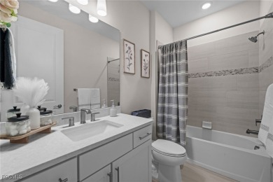 Why wait to build when you can have nearly new? This light and on River Hall Country Club in Florida - for sale on GolfHomes.com, golf home, golf lot