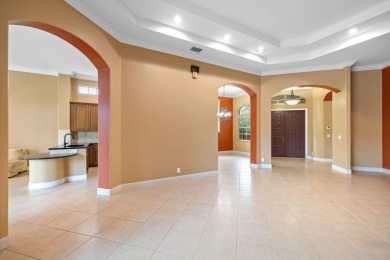 Elegant 4BR/3BA estate home in Osprey Isles, surrounded by on Palm Beach Gardens Golf Course in Florida - for sale on GolfHomes.com, golf home, golf lot