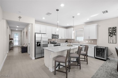 Why wait to build when you can have nearly new? This light and on River Hall Country Club in Florida - for sale on GolfHomes.com, golf home, golf lot