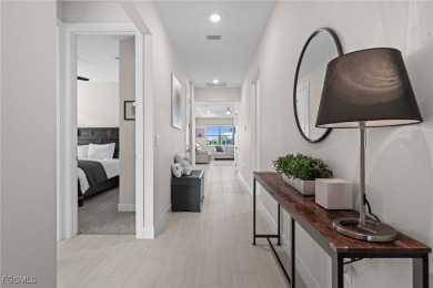 Why wait to build when you can have nearly new? This light and on River Hall Country Club in Florida - for sale on GolfHomes.com, golf home, golf lot