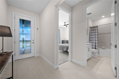Why wait to build when you can have nearly new? This light and on River Hall Country Club in Florida - for sale on GolfHomes.com, golf home, golf lot