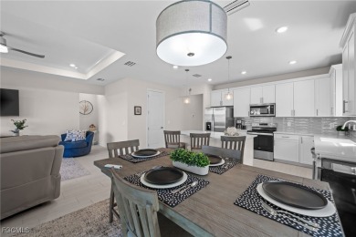 Why wait to build when you can have nearly new? This light and on River Hall Country Club in Florida - for sale on GolfHomes.com, golf home, golf lot