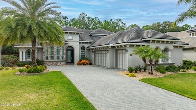 Welcome to this exquisite 5-bedroom, 4-bath luxury estate with a on Plantation Bay Golf and Country Club in Florida - for sale on GolfHomes.com, golf home, golf lot