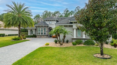 Welcome to this exquisite 5-bedroom, 4-bath luxury estate with a on Plantation Bay Golf and Country Club in Florida - for sale on GolfHomes.com, golf home, golf lot