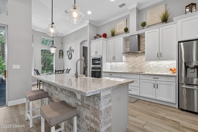 Welcome to this exquisite 5-bedroom, 4-bath luxury estate with a on Plantation Bay Golf and Country Club in Florida - for sale on GolfHomes.com, golf home, golf lot