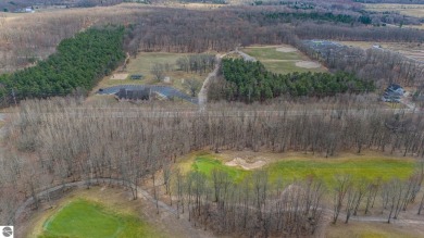 This fantastic wooded golf course lot with access to Houghton on Quest Golf Club in Michigan - for sale on GolfHomes.com, golf home, golf lot