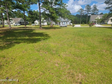 Pond-front home site ready for your dream home located in the on Sea Trail Golf Resort in North Carolina - for sale on GolfHomes.com, golf home, golf lot