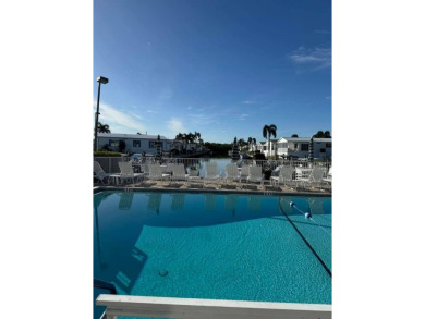 Imagine docking your 35 foot Boat behind your home. This on Windstar on Naples Bay in Florida - for sale on GolfHomes.com, golf home, golf lot