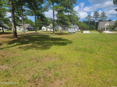 Pond-front home site ready for your dream home located in the on Sea Trail Golf Resort in North Carolina - for sale on GolfHomes.com, golf home, golf lot