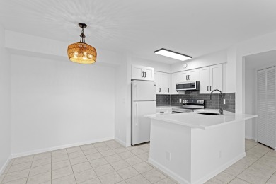 ABSOLUTELY GORGEOUS FIRST FLOOR CONDO | PRESTIGIOUS 55+ on Forest Oaks Golf Club in Florida - for sale on GolfHomes.com, golf home, golf lot