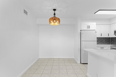 ABSOLUTELY GORGEOUS FIRST FLOOR CONDO | PRESTIGIOUS 55+ on Forest Oaks Golf Club in Florida - for sale on GolfHomes.com, golf home, golf lot