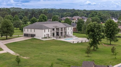 A showcase of modern elegance, this 6-bed, 7.5-bath contemporary on Paragould Country Club in Arkansas - for sale on GolfHomes.com, golf home, golf lot