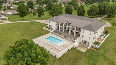 A showcase of modern elegance, this 6-bed, 7.5-bath contemporary on Paragould Country Club in Arkansas - for sale on GolfHomes.com, golf home, golf lot