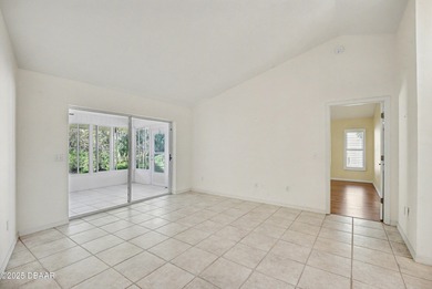 Nestled on a desirable corner lot overlooking a tranquil pond in on Spruce Creek Golf Club in Florida - for sale on GolfHomes.com, golf home, golf lot