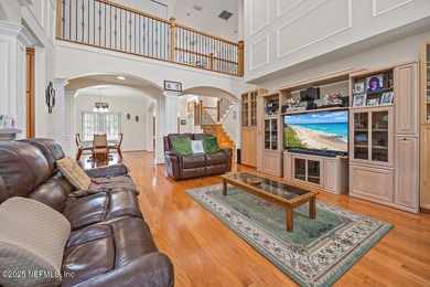 Custom 5-Bed North Hampton stunner with pond views, soaring on Golf Club At North Hampton in Florida - for sale on GolfHomes.com, golf home, golf lot