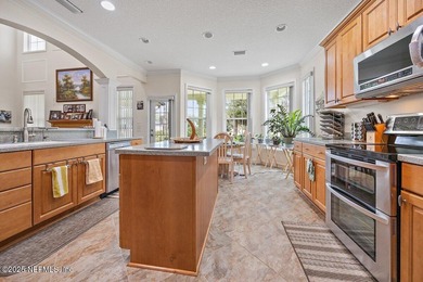 Custom 5-Bed North Hampton stunner with pond views, soaring on Golf Club At North Hampton in Florida - for sale on GolfHomes.com, golf home, golf lot