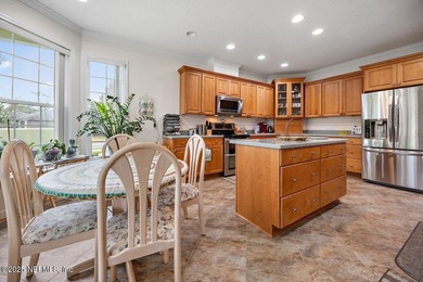 Custom 5-Bed North Hampton stunner with pond views, soaring on Golf Club At North Hampton in Florida - for sale on GolfHomes.com, golf home, golf lot