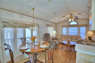 WELCOME TO YOUR FLORIDA RETIREMENT OASIS IN A GATED/GOLF CART on Southern Dunes Golf and Country Club in Florida - for sale on GolfHomes.com, golf home, golf lot