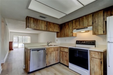 PRICED TO SELL!   This FIRST FLOOR condo located in desirable on East Lake Woodlands Country Club in Florida - for sale on GolfHomes.com, golf home, golf lot