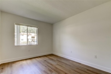 PRICED TO SELL!   This FIRST FLOOR condo located in desirable on East Lake Woodlands Country Club in Florida - for sale on GolfHomes.com, golf home, golf lot
