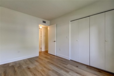 PRICED TO SELL!   This FIRST FLOOR condo located in desirable on East Lake Woodlands Country Club in Florida - for sale on GolfHomes.com, golf home, golf lot