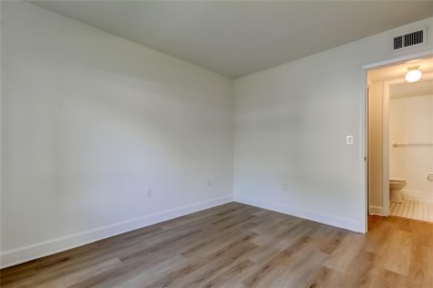 PRICED TO SELL!   This FIRST FLOOR condo located in desirable on East Lake Woodlands Country Club in Florida - for sale on GolfHomes.com, golf home, golf lot