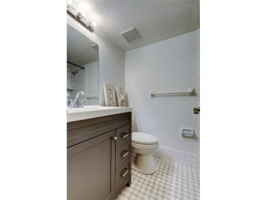 PRICED TO SELL!   This FIRST FLOOR condo located in desirable on East Lake Woodlands Country Club in Florida - for sale on GolfHomes.com, golf home, golf lot