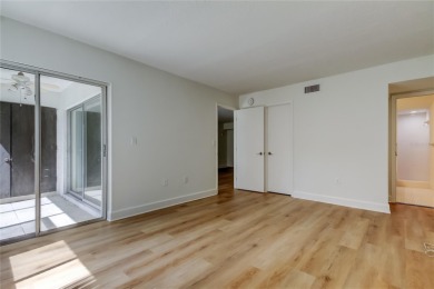 PRICED TO SELL!   This FIRST FLOOR condo located in desirable on East Lake Woodlands Country Club in Florida - for sale on GolfHomes.com, golf home, golf lot