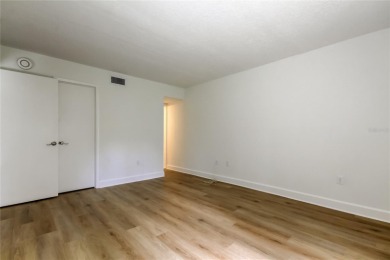 PRICED TO SELL!   This FIRST FLOOR condo located in desirable on East Lake Woodlands Country Club in Florida - for sale on GolfHomes.com, golf home, golf lot