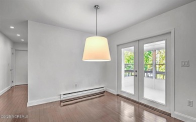 Experience modern elegance in this stunning top-floor condo on Pine Brook Golf Course in New Jersey - for sale on GolfHomes.com, golf home, golf lot